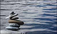 rocks stacked by a lake