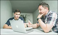 two men working two men working