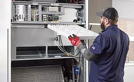 technician working on HVAC system