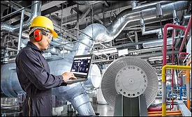 man with hard hat working on hvac equipment