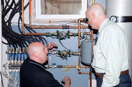 David Holdorf, Taco's Residential Trainer & Rep Training Manager, Eastern Region (left) and Steve Anderson, Account Manager for F.W. WebbÃ¢??s Methuen Office, discuss integration of the hydronic systemÃ¢??s key components.